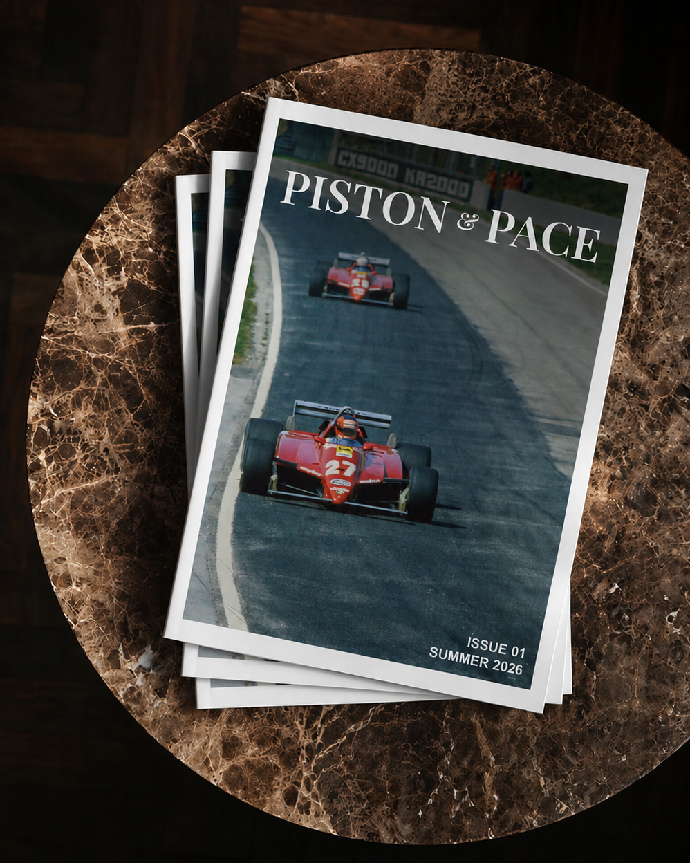 Stack of magazines titled 'Piston of Pace' on a textured surface