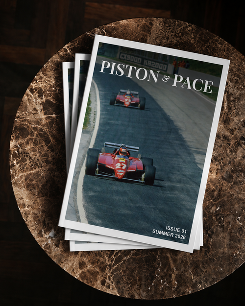 Stack of magazines titled 'Piston of Pace' on a textured surface